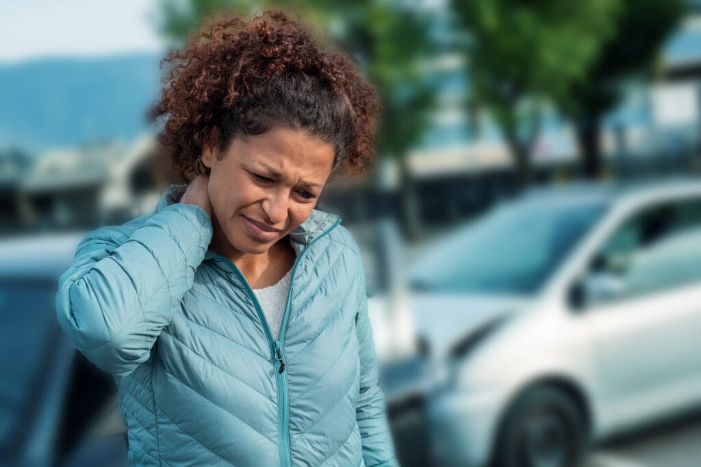 Painful neck ache after fender bender car crash – Mountain Land Physical Therapy Person in Car Accident with Whiplash